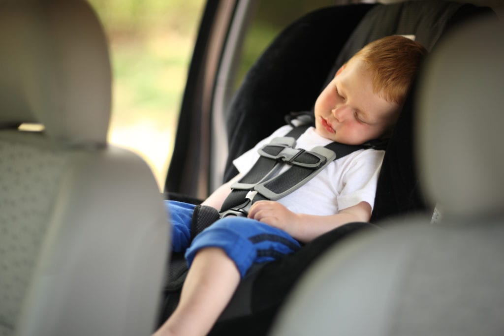 Child sleeping in car seat