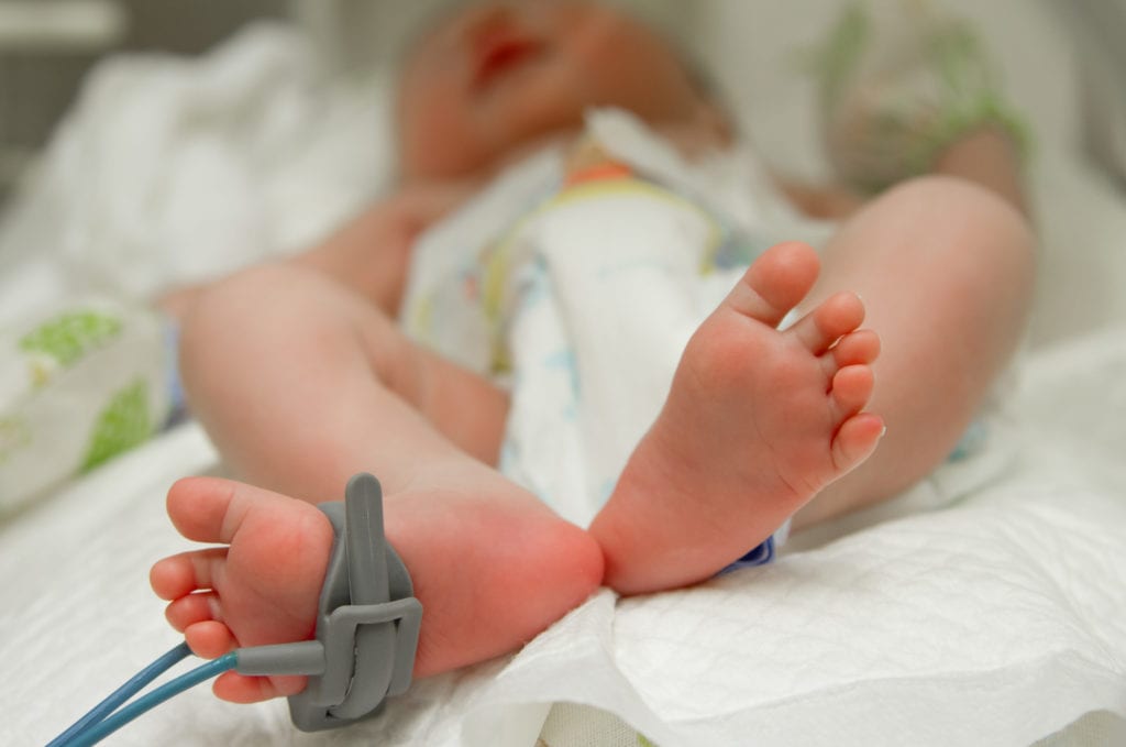 close up of a baby's foot in the hospital