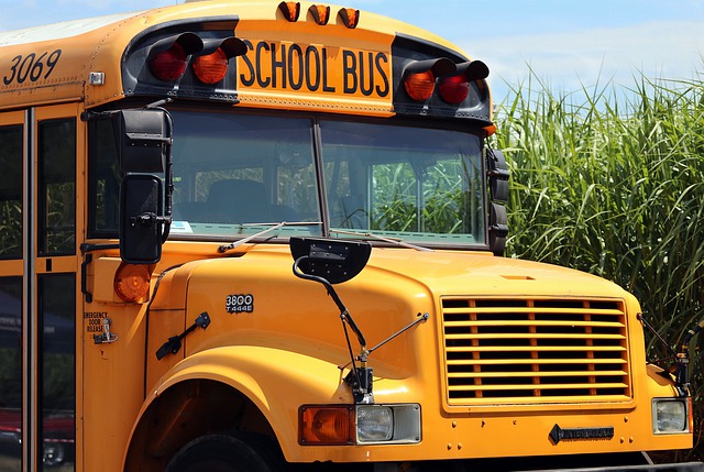 A picture of the front of a yellow school bus.